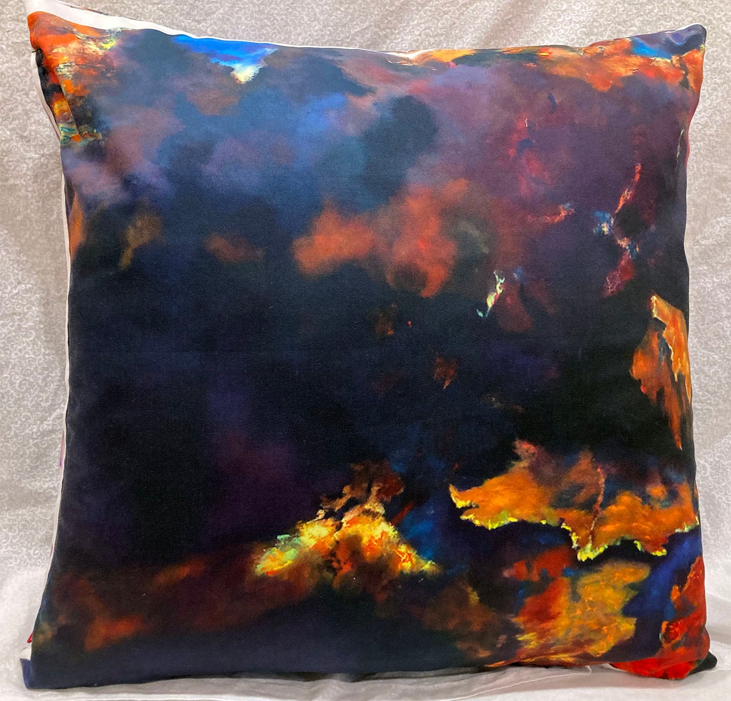 decorative pillow with pillow form insert abstract leaves and dark clouds from original painting yellow, red, orange, purple, blues dark background